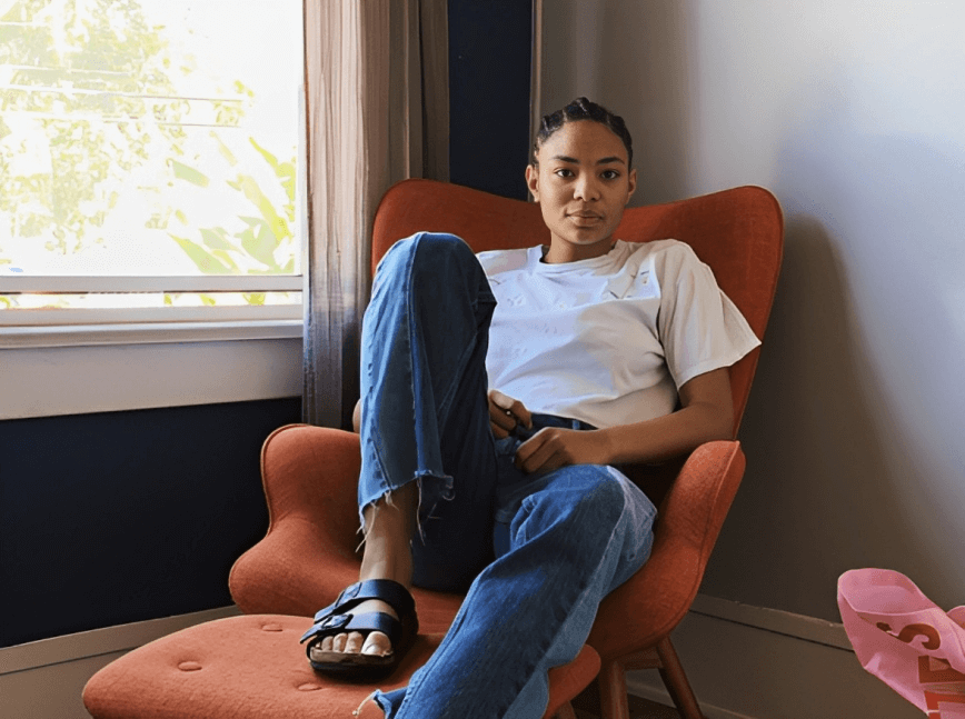 A woman sitting in a chair in a room.